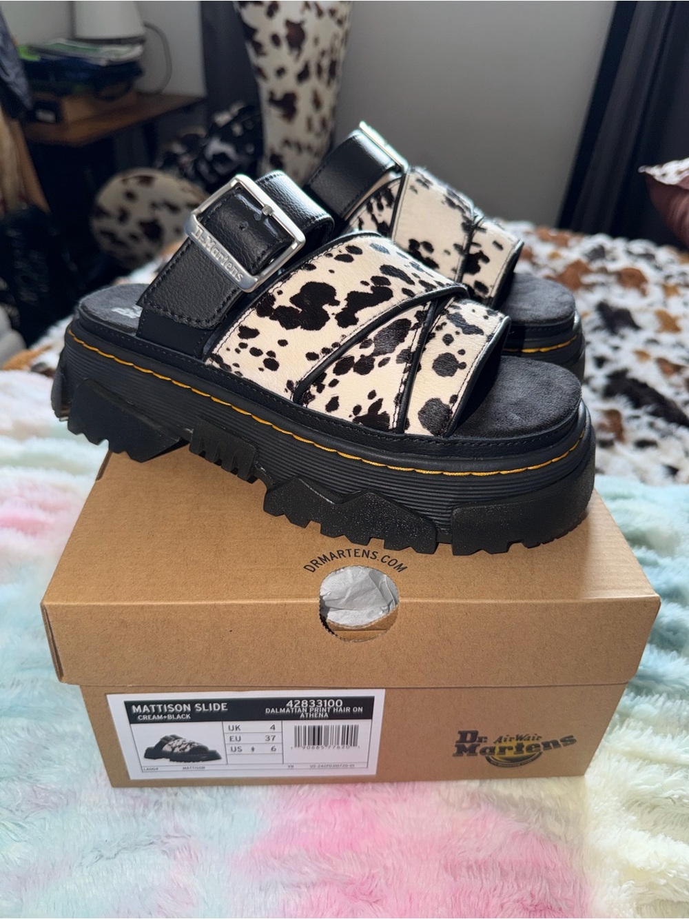 Dr. Martens Mattison Slide Sandals in Black & White Cow Print